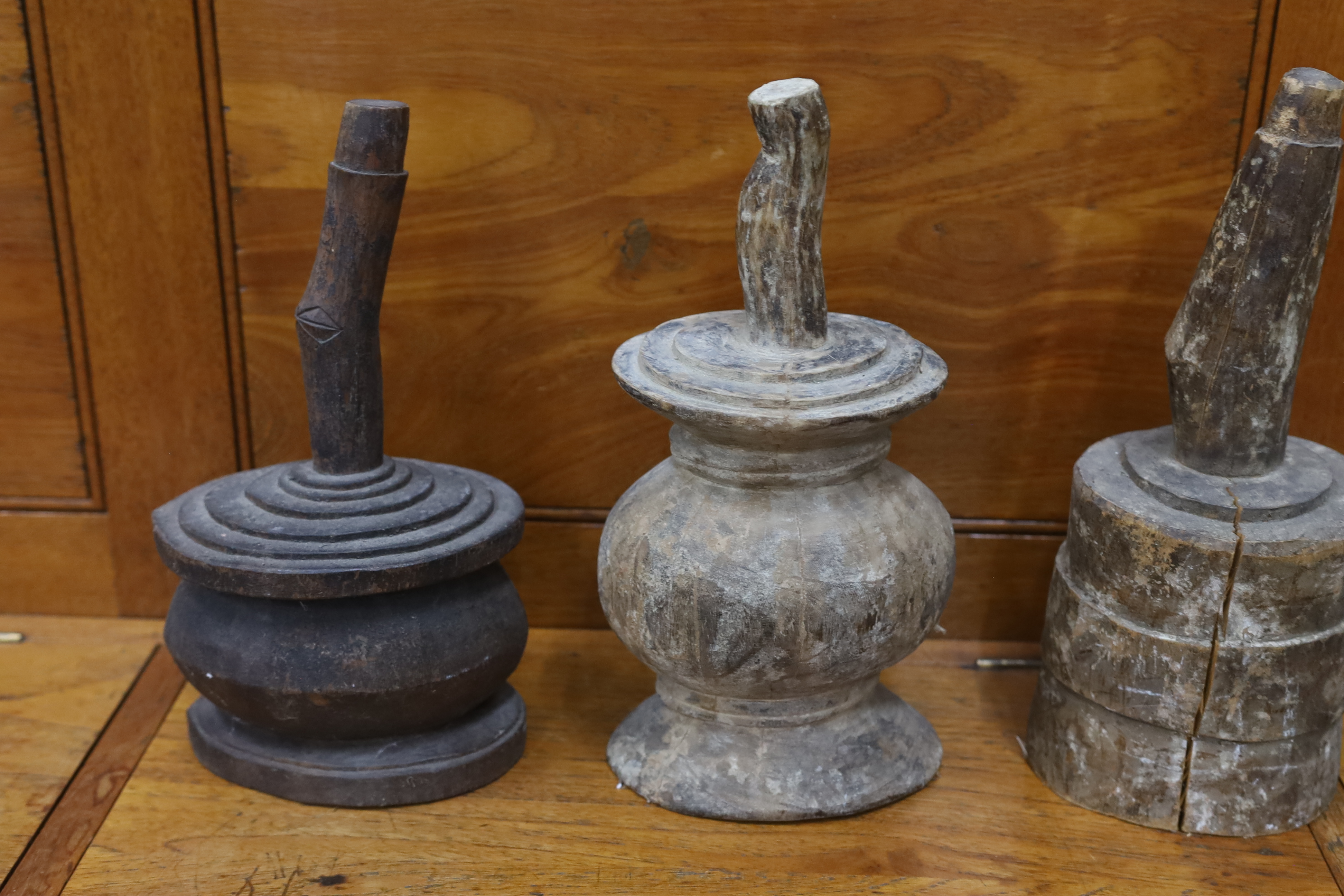 A Victorian cast iron boot scraper and three African wood mallets